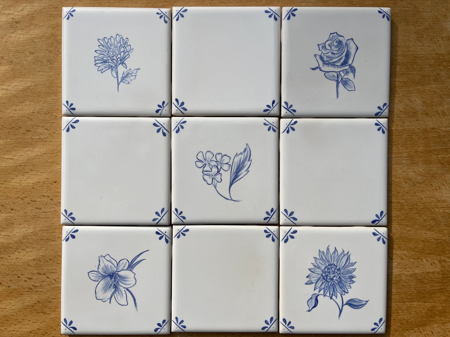 Set of nine hand painted 4.25" tiles _Flowers motif